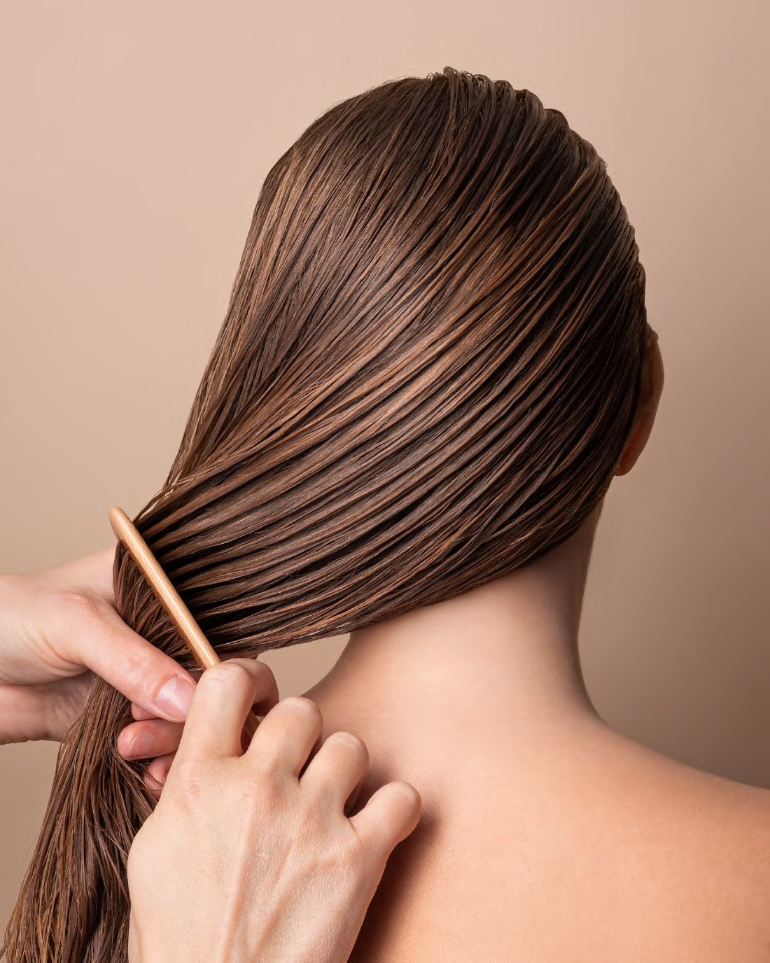 Hair being combed through during a care treatment
